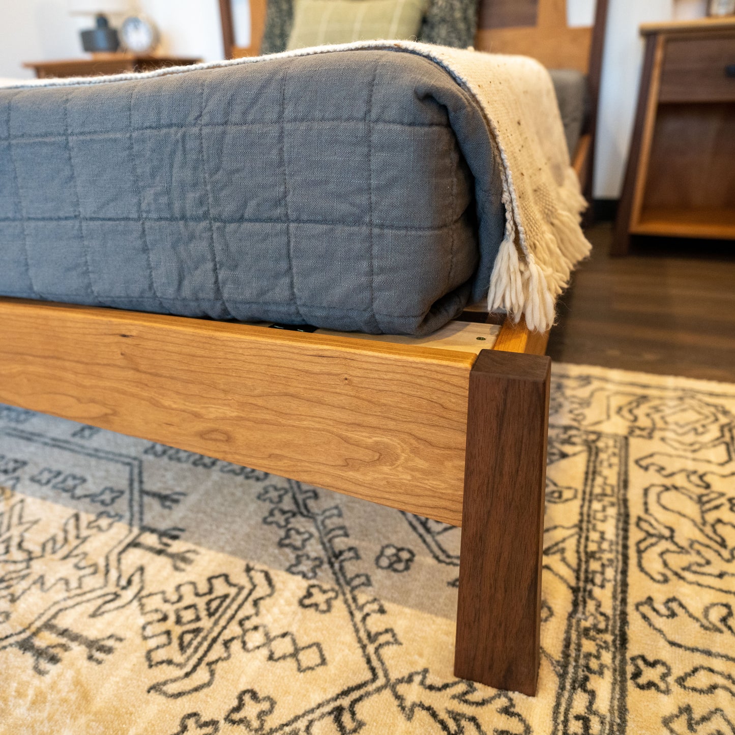 The Valamont Walnut + Cherry Bed Frame and Headboard